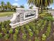 Beautiful landscaping surrounds the Lakewood National community welcome sign at 17902 Gawthrop Dr # 401, Bradenton, FL 34211
