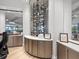 The wine cellar features an illuminated display case and counter perfect for storing favorite bottles at 17902 Gawthrop Dr # 401, Bradenton, FL 34211