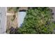 An aerial view shows the roof, yard, and mature trees of this single-story home on a residential street at 1823 8Th E Ave, Bradenton, FL 34208