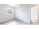 Bedroom featuring a large closet, light wood flooring, and neutral paint at 1823 8Th E Ave, Bradenton, FL 34208