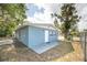 Exterior view with door and patio area, and neutral paint at 1823 8Th E Ave, Bradenton, FL 34208