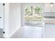 Well-lit living room with sliding glass doors leading to a backyard at 1823 8Th E Ave, Bradenton, FL 34208