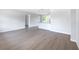 Bright living room and open floor plan featuring sleek, modern flooring and fresh, neutral paint at 1823 8Th E Ave, Bradenton, FL 34208