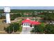 Aerial view of a fire station featuring a red roof and surrounding greenery at 2005 47Th Street W Ct, Bradenton, FL 34209