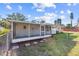 Lush backyard featuring a screened-in patio, well-kept lawn, and fenced perimeter at 2005 47Th Street W Ct, Bradenton, FL 34209