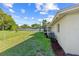 Well-maintained backyard featuring lush lawn and the exterior of the home at 2005 47Th Street W Ct, Bradenton, FL 34209