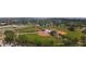 Aerial view of a baseball field and park with playground, and tennis courts at 2005 47Th Street W Ct, Bradenton, FL 34209