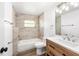 Well-lit bathroom with a modern vanity and shower over tub at 2005 47Th Street W Ct, Bradenton, FL 34209