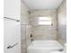 Clean bathroom features tub with tiled walls and new fixtures at 2005 47Th Street W Ct, Bradenton, FL 34209