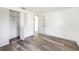 Bedroom features light wood-look floors, and closet with folding doors, with a door leading to another room at 2005 47Th Street W Ct, Bradenton, FL 34209