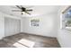 Bright bedroom features light wood-look floors, ceiling fan, and natural light from multiple windows at 2005 47Th Street W Ct, Bradenton, FL 34209