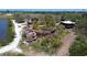 Elevated playground with wood structures, slides, and platforms surrounded by trees and pathways at 2005 47Th Street W Ct, Bradenton, FL 34209