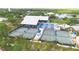 Aerial shot featuring well-maintained tennis courts with adjacent covered seating areas at 2005 47Th Street W Ct, Bradenton, FL 34209