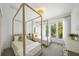 Inviting bedroom featuring two beds, bright windows, and soft natural light throughout the room at 2124 Wisteria St, Sarasota, FL 34239