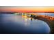Scenic sunset view of a bridge over water, with lights reflecting and palm trees lining the shore at 2124 Wisteria St, Sarasota, FL 34239