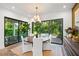 Elegant dining room with garden views and plenty of natural light to entertain Gathering and friends at 2124 Wisteria St, Sarasota, FL 34239