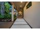 Inviting exterior patio and walkway with lush greenery, and direct access to the beautifully lit outdoor space at 2124 Wisteria St, Sarasota, FL 34239