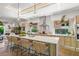 Bright kitchen with an island, quartz countertops, stainless steel appliances, and designer accents at 2124 Wisteria St, Sarasota, FL 34239