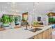 Modern kitchen with quartz countertops, stylish bar stools, and an adjacent dining area at 2124 Wisteria St, Sarasota, FL 34239