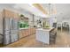 Spacious kitchen featuring stainless steel appliances, a large island, and modern finishes at 2124 Wisteria St, Sarasota, FL 34239