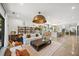 Open-concept living area with modern décor seamlessly connected to the kitchen and staircase at 2124 Wisteria St, Sarasota, FL 34239