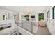 Cozy loft area with comfortable seating, natural light, and stylish decor with serene views of surrounding landscapes at 2124 Wisteria St, Sarasota, FL 34239