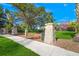 Park entrance features brick columns, a stone statue, and a well-maintained lawn area under a clear blue sky at 2124 Wisteria St, Sarasota, FL 34239