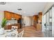 Spacious eat-in kitchen with stainless appliances, wood cabinets, and sliding doors to the patio at 217 Giotto Dr, Nokomis, FL 34275