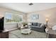 Comfortable living room with a large window providing plenty of natural light and neutral decor at 217 Giotto Dr, Nokomis, FL 34275