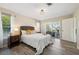Comfortable main bedroom features cozy furniture, stylish flooring, and access to the patio at 217 Giotto Dr, Nokomis, FL 34275