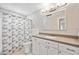 Bathroom features a vanity, large mirror, and shower with a shower curtain at 219 Marlin Dr, Punta Gorda, FL 33950