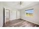 Simple bedroom with neutral walls, wood-look floors, and dual closets offers ample storage at 219 Marlin Dr, Punta Gorda, FL 33950