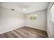 Minimalist bedroom with a ceiling fan and a bright window, ready for personalization at 219 Marlin Dr, Punta Gorda, FL 33950