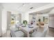Bright dining area with seating for six, opens to a living room with modern coastal decor at 219 Marlin Dr, Punta Gorda, FL 33950