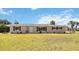Charming single-story home featuring a well-manicured lawn, neutral paint and black shutters at 219 Marlin Dr, Punta Gorda, FL 33950