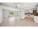 Open-concept kitchen features white cabinets, tile floors and is open to the living area at 219 Marlin Dr, Punta Gorda, FL 33950