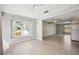 Bright and spacious living room featuring tile flooring and natural light through the window at 219 Marlin Dr, Punta Gorda, FL 33950