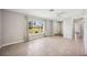 Bright living room with tile floors, neutral walls, and large window at 219 Marlin Dr, Punta Gorda, FL 33950
