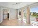 Versatile bonus room or dining area with laundry closet and sliding glass doors to backyard at 219 Marlin Dr, Punta Gorda, FL 33950