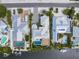 Aerial view of a waterfront property with a pool, lush landscaping, and a private dock at 224 Chilson Ave, Anna Maria, FL 34216