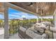 Spacious balcony with comfortable seating, a coffee table, and neighborhood views at 224 Chilson Ave, Anna Maria, FL 34216