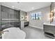 Luxurious bathroom with freestanding tub, glass enclosed shower, and dual vanities at 224 Chilson Ave, Anna Maria, FL 34216
