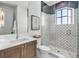 Beautiful bathroom featuring an enclosed glass shower with patterned tiling at 224 Chilson Ave, Anna Maria, FL 34216