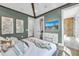 Beautiful bedroom with vaulted ceiling, luxury vinyl flooring, and en suite bathroom at 224 Chilson Ave, Anna Maria, FL 34216