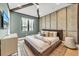 Stylish bedroom with wooden beam ceiling and accent wall at 224 Chilson Ave, Anna Maria, FL 34216