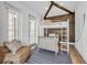 Comfortable bedroom featuring a stylish bunk bed, high ceiling, and natural light at 224 Chilson Ave, Anna Maria, FL 34216