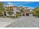 Stately home with a grand facade and a paved driveway, perfect for luxury living at 224 Chilson Ave, Anna Maria, FL 34216