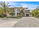 Beautiful two-story home features tropical landscaping and a lovely paved driveway at 224 Chilson Ave, Anna Maria, FL 34216