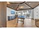 Fun game room featuring vaulted ceilings, custom bar, and spiral staircase access at 224 Chilson Ave, Anna Maria, FL 34216
