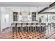 Beautiful kitchen with a large island, seating, modern lighting, and plenty of cabinet space at 224 Chilson Ave, Anna Maria, FL 34216